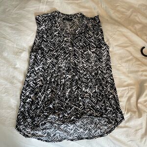 Chic Black and White Sleeveless Blouse with Elegant Design
